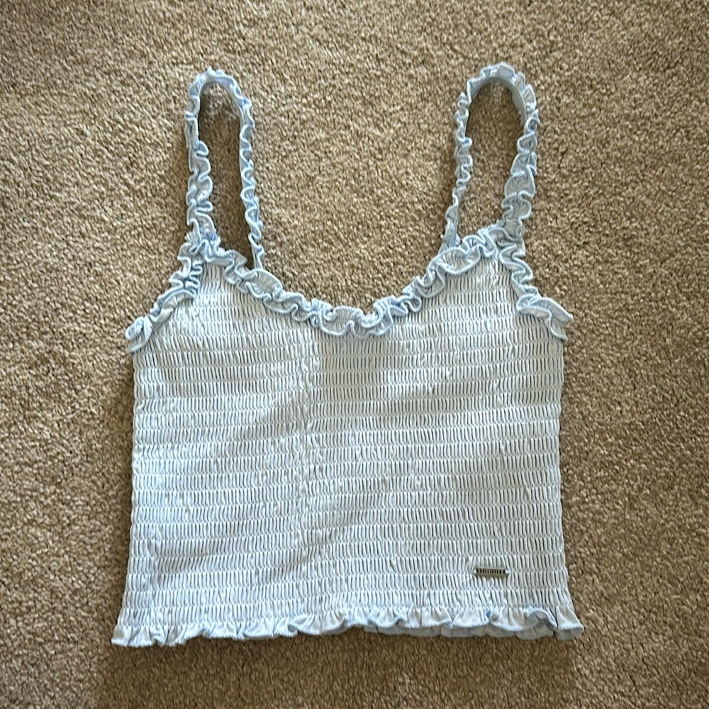 Hollister light blue top, size XS, never worn. Perfect for a fresh summer look!